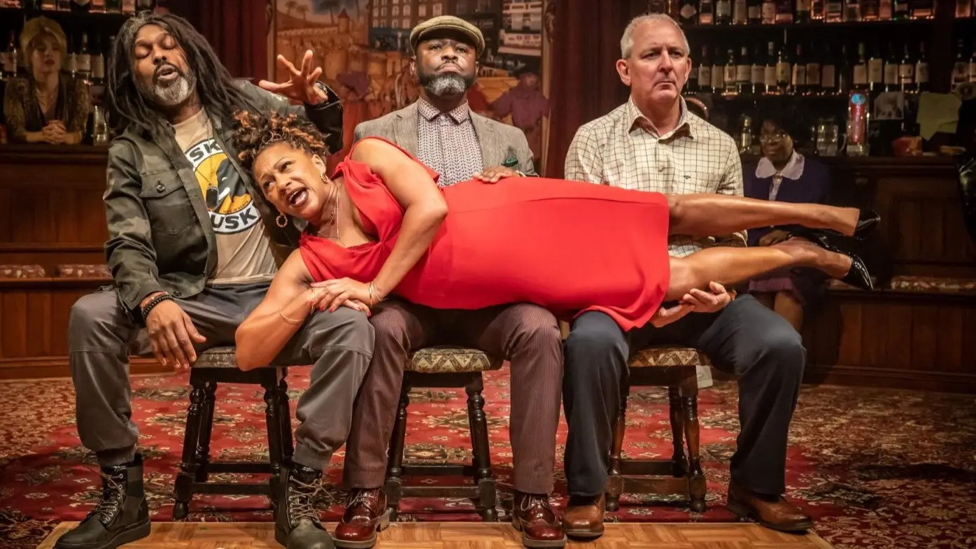 National Theatre Live: The Wife of Willesden backdrop